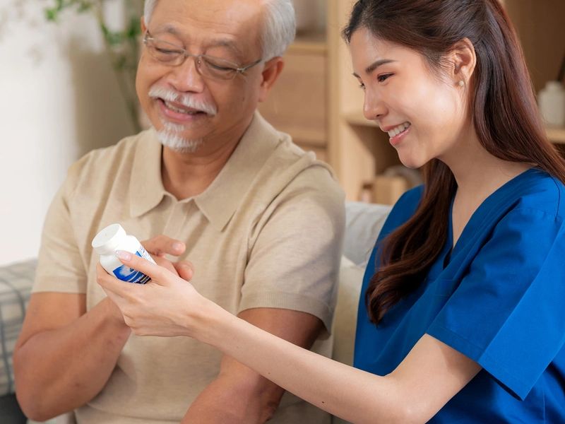 Home health aide assisting senior at home